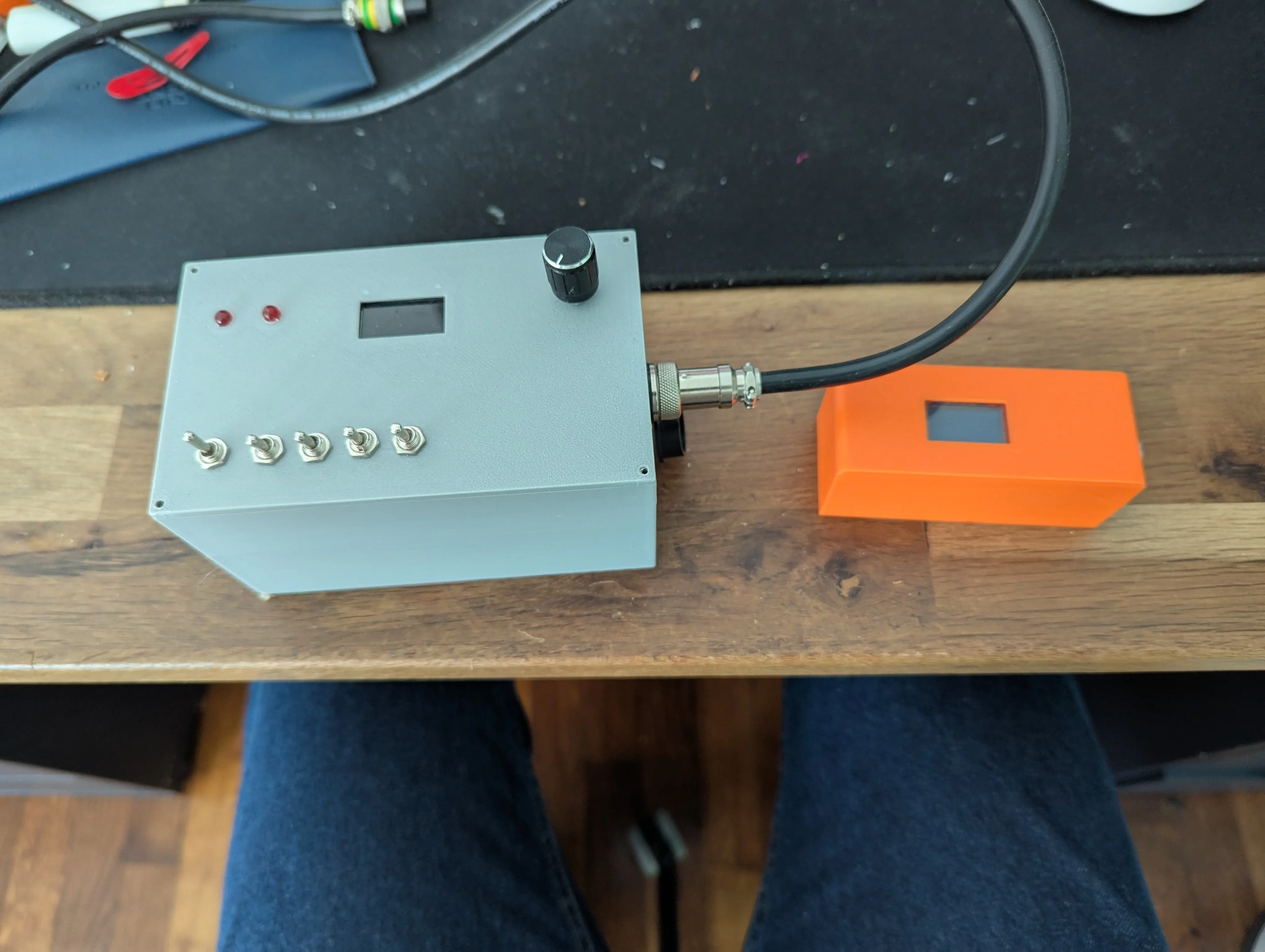 A photograph of the finish controller in its box, next to the olde one